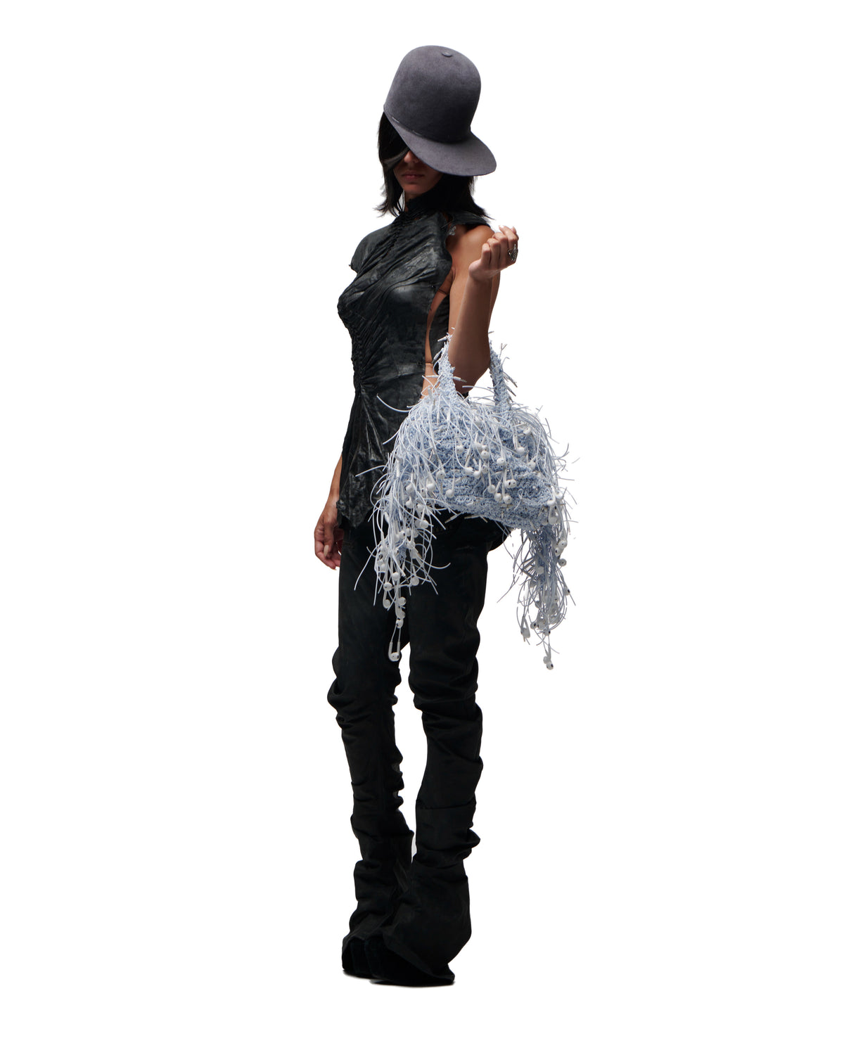 Earphone handbag, carried by a model